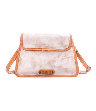White crossbody bag with orange accents on a white background